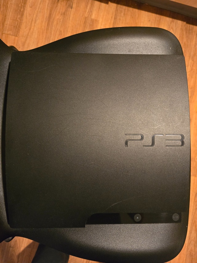 PS3 slim 320gb with 1 game