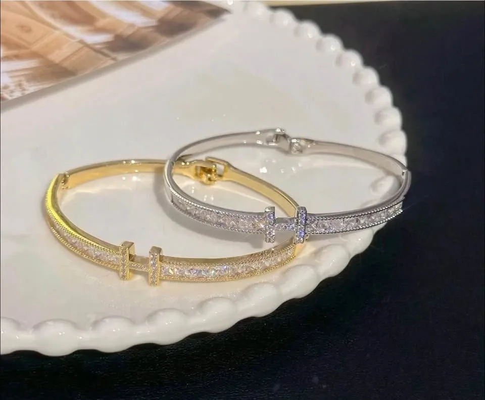 gold-Platted bangle bracelet with a - encrusted "H" initial image indicator(4)