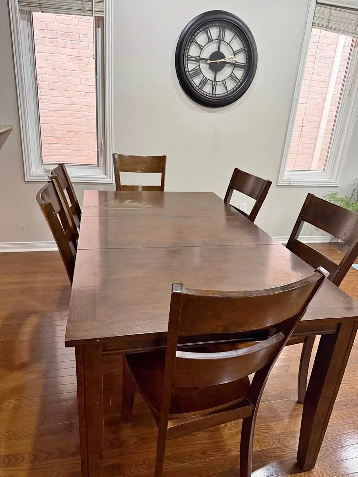 Wooden dining table with six chairs