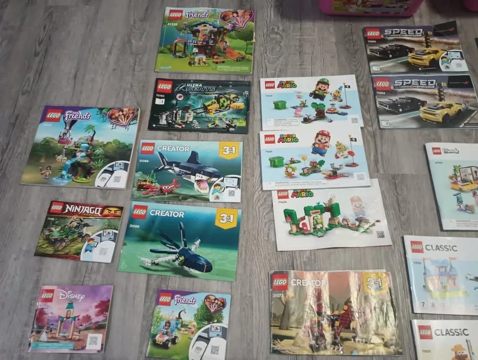 Lot of 50 Lego Building Instruction Manuals & 2 Containers image indicator(7)