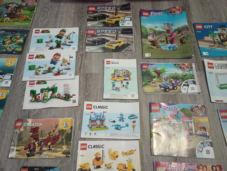 Lot of 50 Lego Building Instruction Manuals & 2 Containers image indicator(8)
