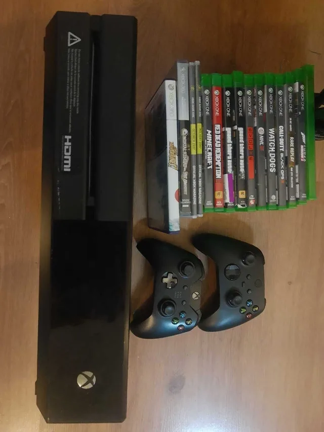 Xbox One console with 16 games and 2 controllers