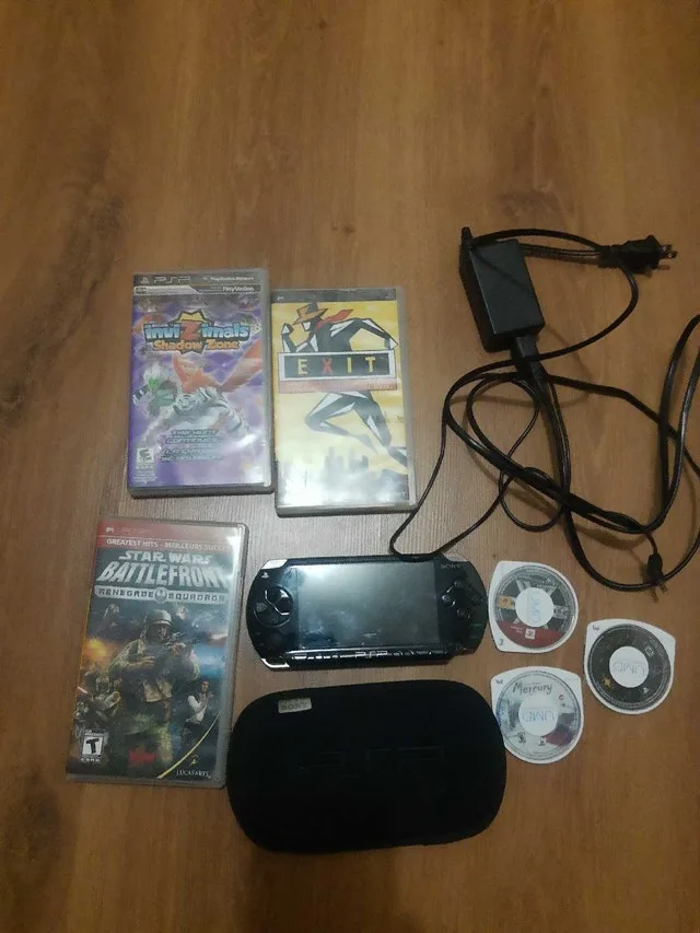 PSP console with games and accessoties