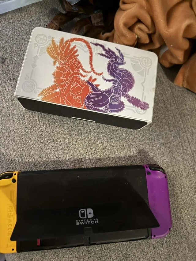 OLED White Nintendo Switch with extras image indicator(3)