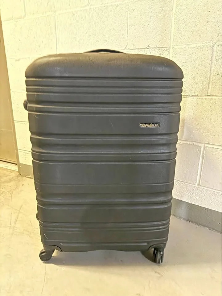 Tracker Check in suit case