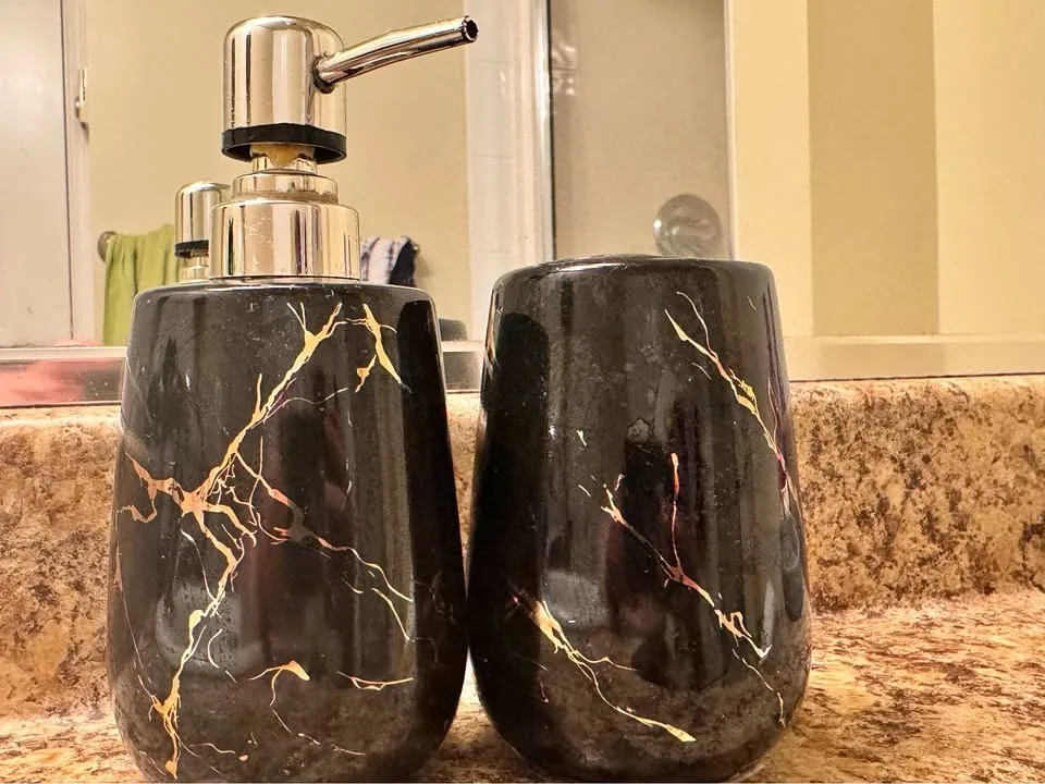 Hand soap dispenser and toothbrush holder