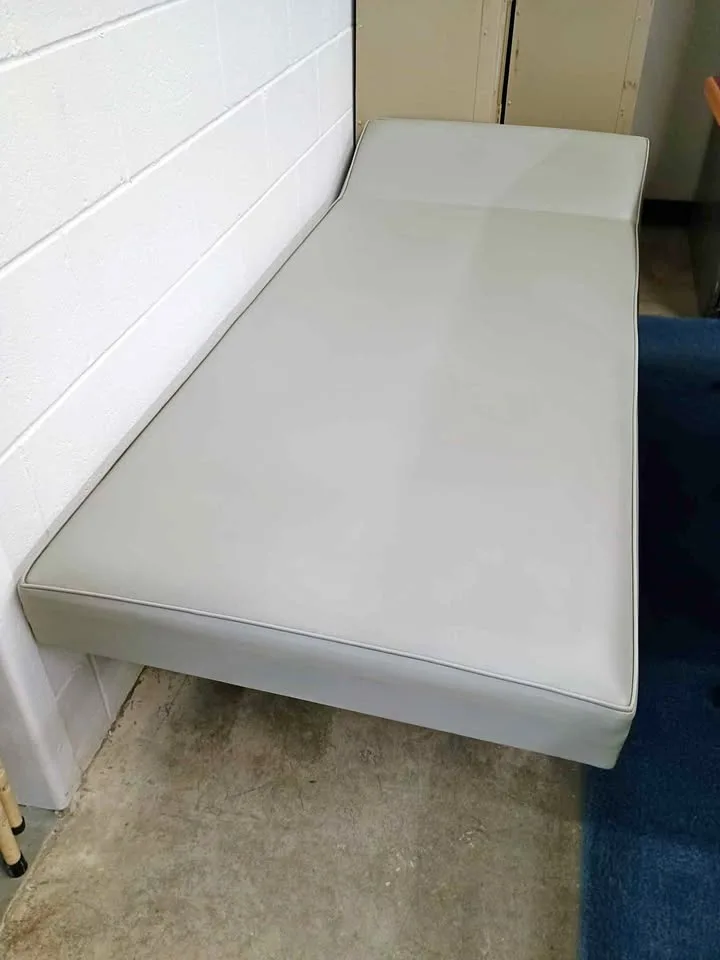 Sturdy Wipeable Cot / Bed With Built In Pillow