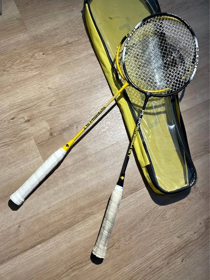 Two Badminton Rackets and Shuttles