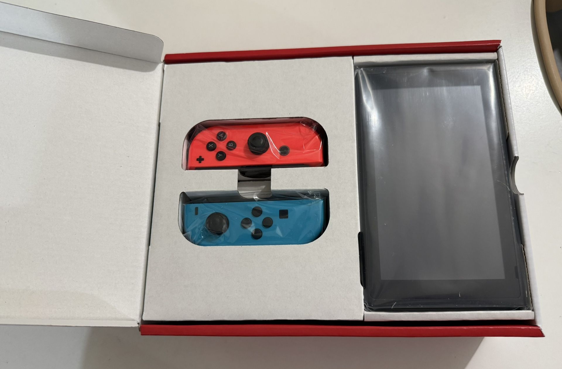 Nintendo Switch V2 (2019) – New – Neon Joy-Cons – 32GB - photo 2