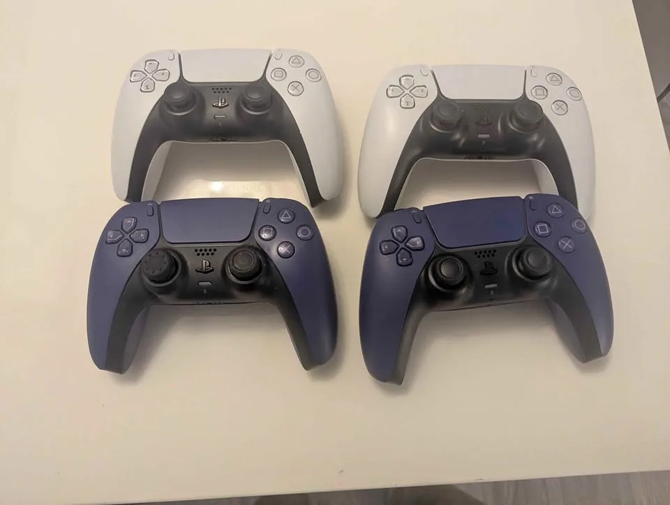 Four PlayStation 5 controllers