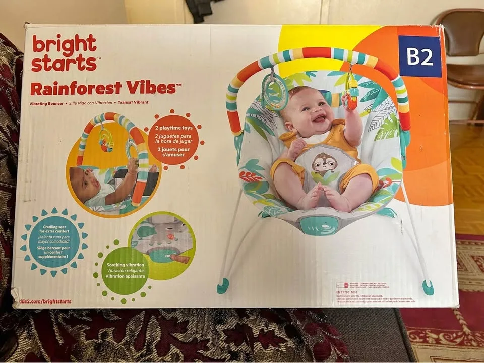 Bright starts rainforest vibes Baby vibrating bouncer