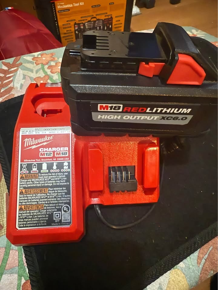 Milwaukee battery and charger 100$ ..charger 25$
