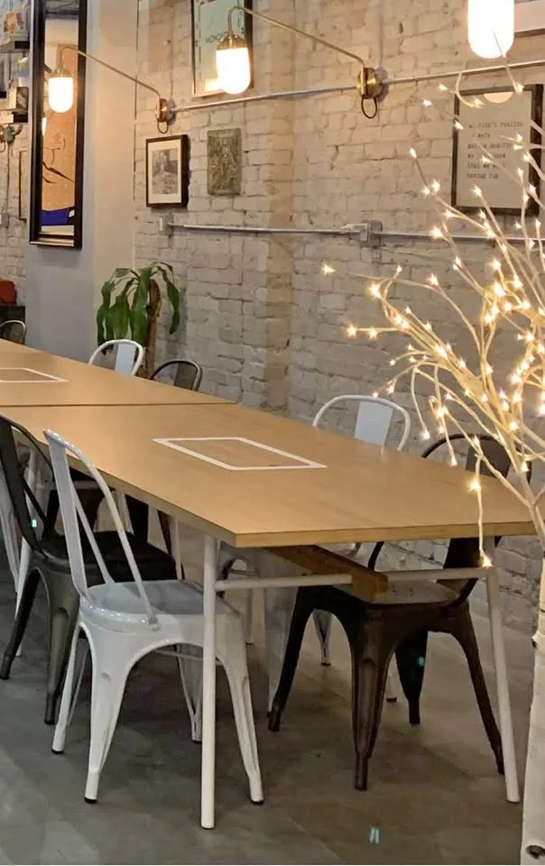 Dining table with storage and cable compartment