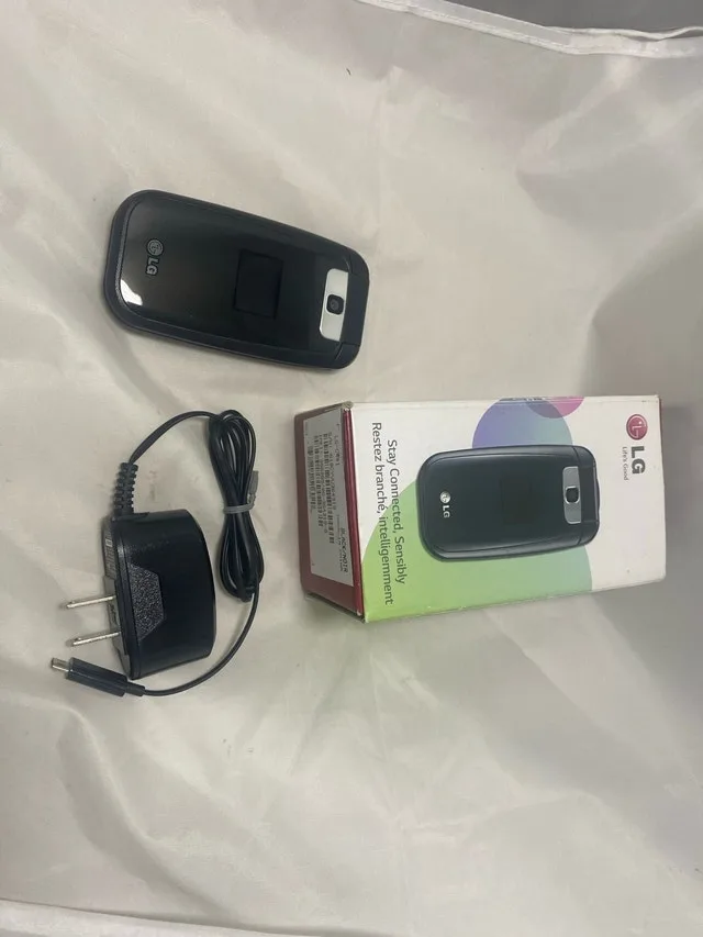 LG F4NR Vintage Mobile Phone Locked To bell With Charg