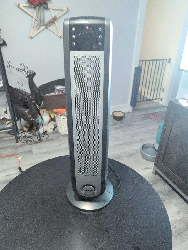 Oscillating tower heater