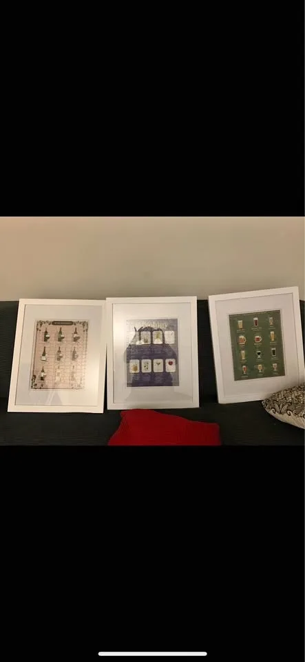 3 white canvas frames with puzzles