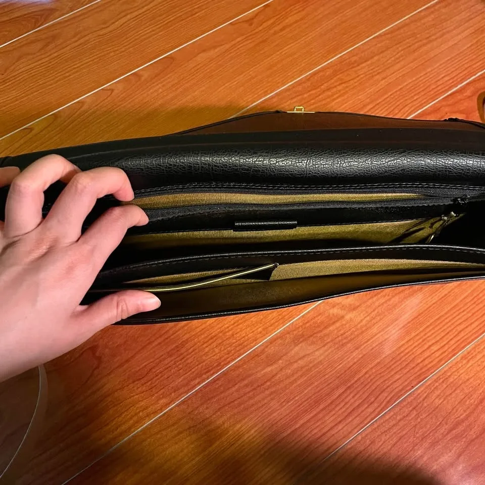 Black Envelope Clutch with Gold Accents image indicator(8)