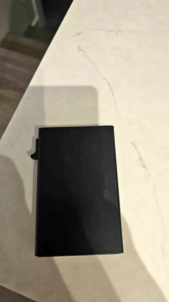 Black metal switch wallet