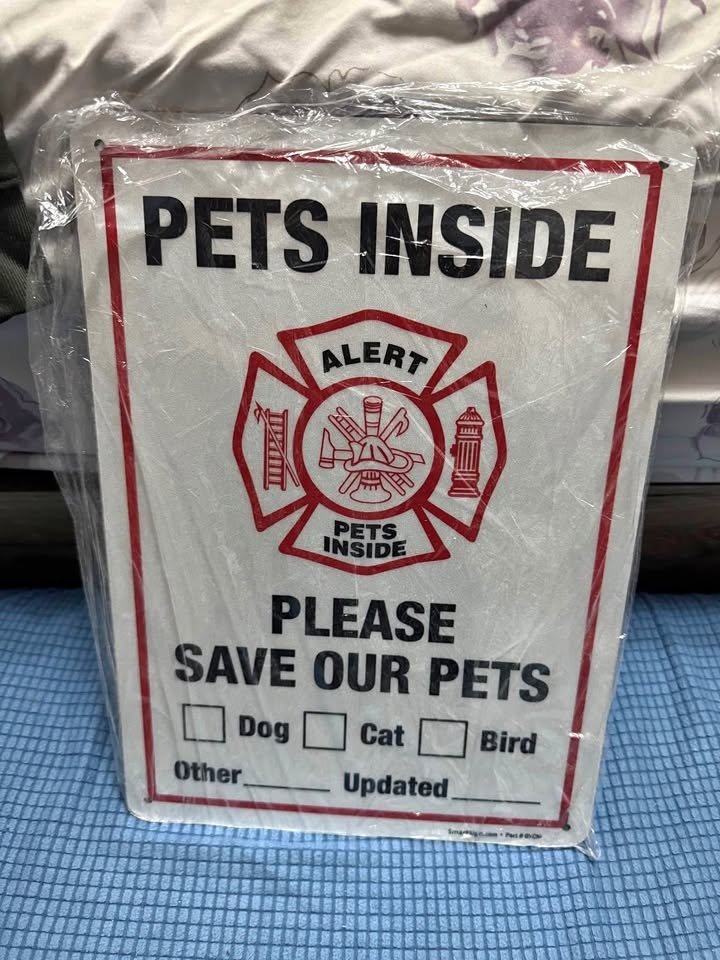 Pets inside metal frame sign