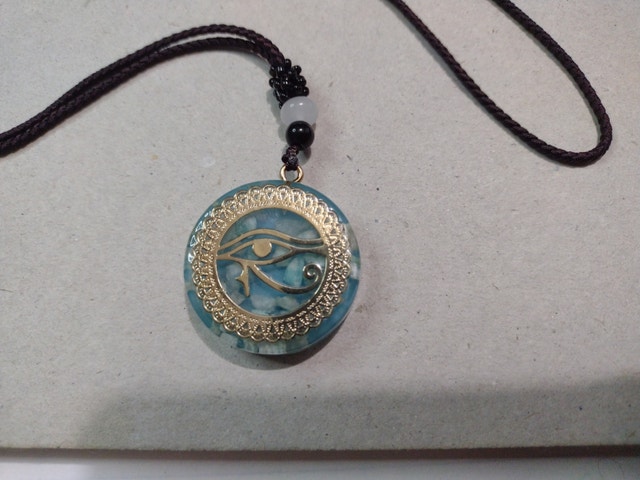 Eye of horus pendant necklace, gold on aquamarine