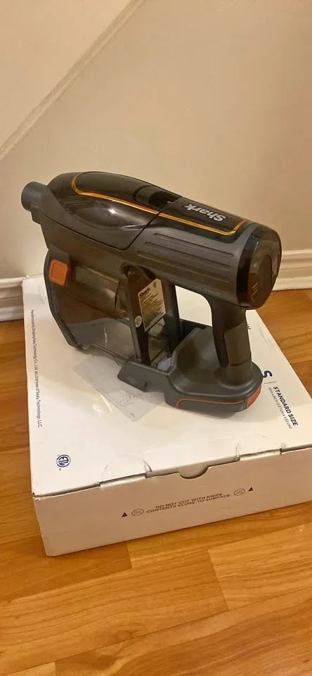 Shark Handheld Vacuum Unit: The motor, dust cup, and handle