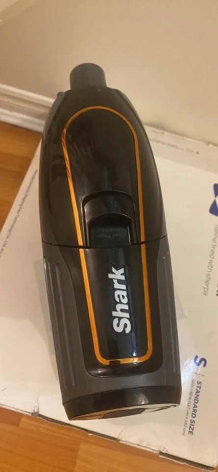 Shark Handheld Vacuum Unit: The motor, dust cup, and handle image indicator(2)