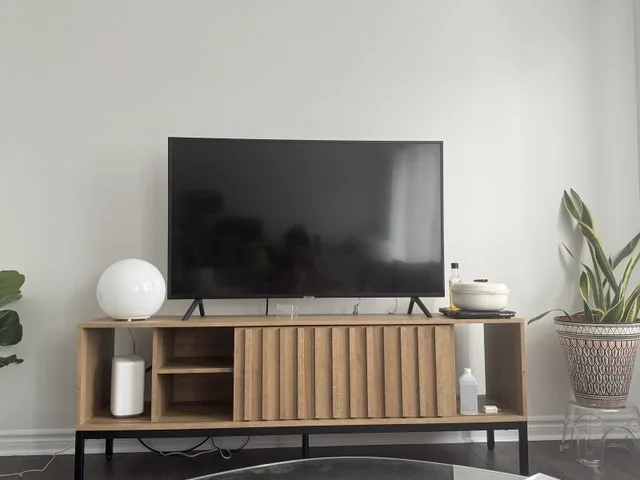 Light Wood TV Stand with Fluted/Paneled Design
