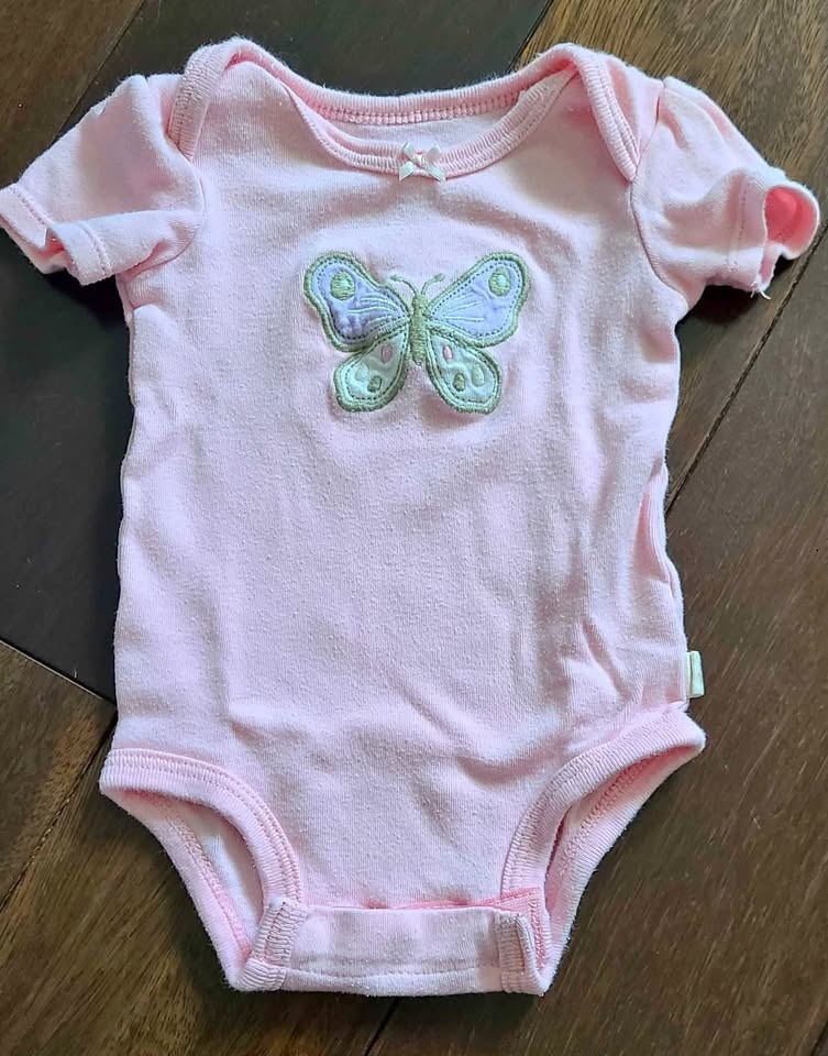 Baby pink onesie newborn size