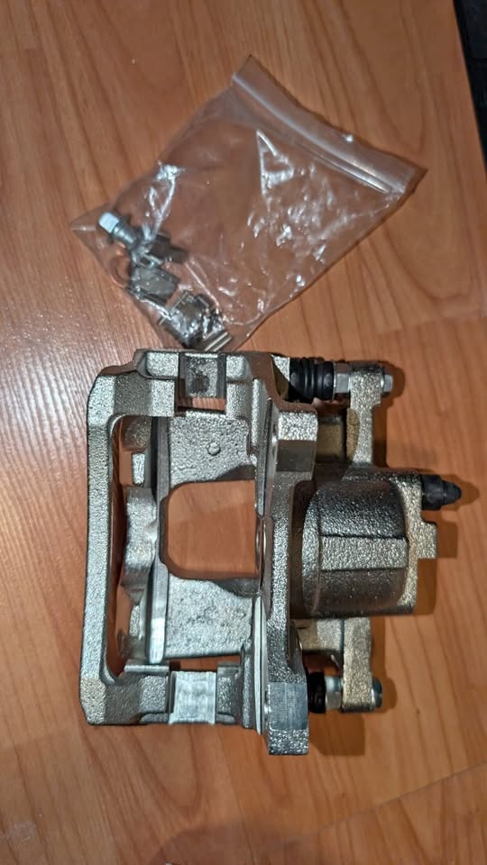 BNIB Rear Passenger caliper check desc.