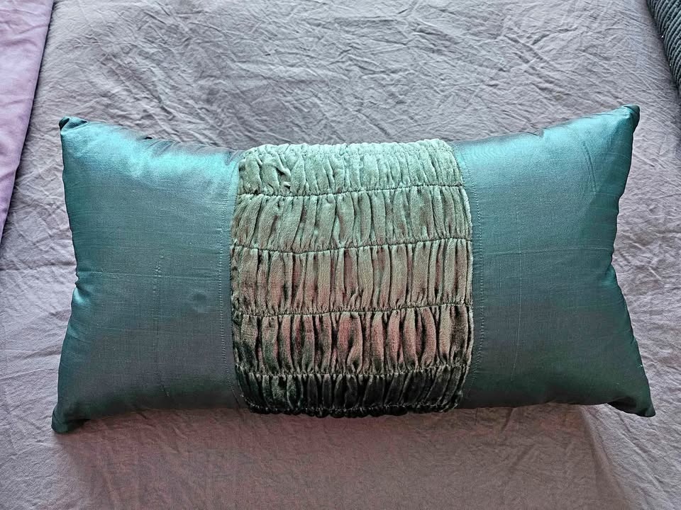 Teal throw pillow 20" x 10", like new.