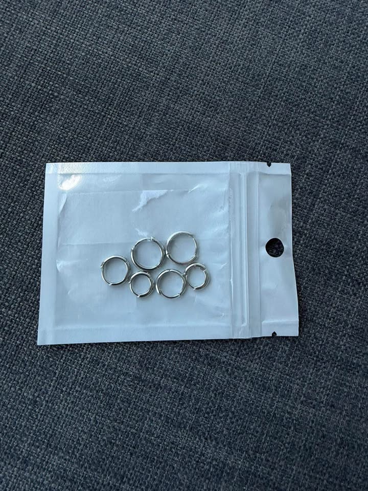 A set of earrings - three pairs of silvery hoops - NEW - photo 2