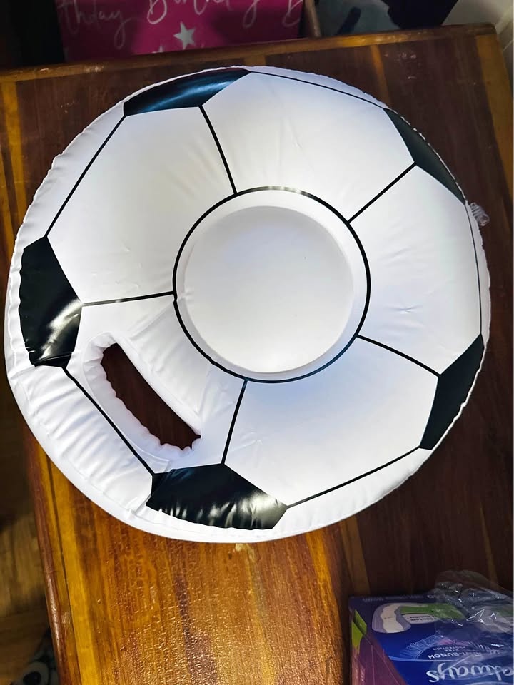 inflating swim ring / pool float shaped like a soccer ball