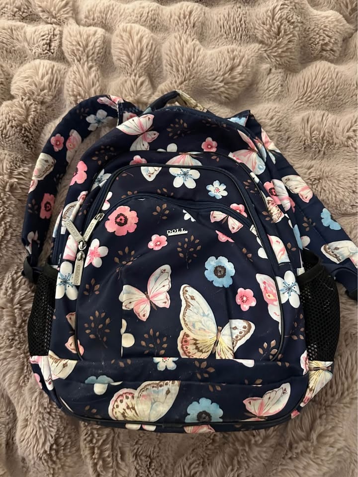 Backpack for a girl with four large compartments