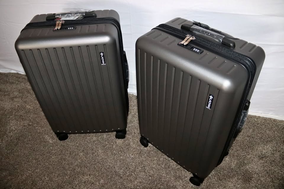 Checked suitcase with a built-in TSA-approved password lock and