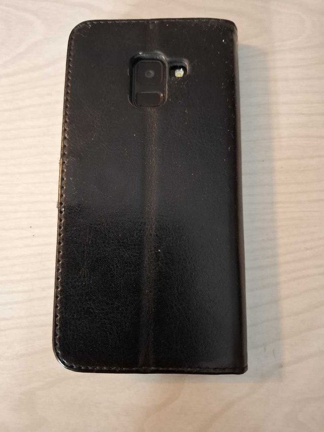 SAMSUNG A8 CELL PHONE - photo 2