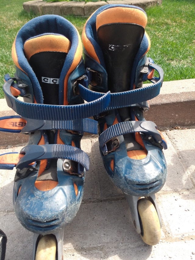 Blue and orange kids rollerblades