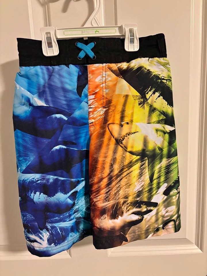Child size medium (7/8) shark-pattern swim shorts