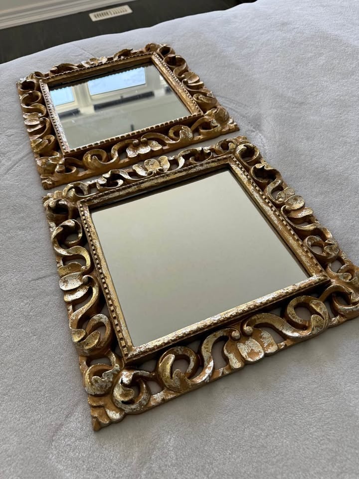 A pair of golden mirrors