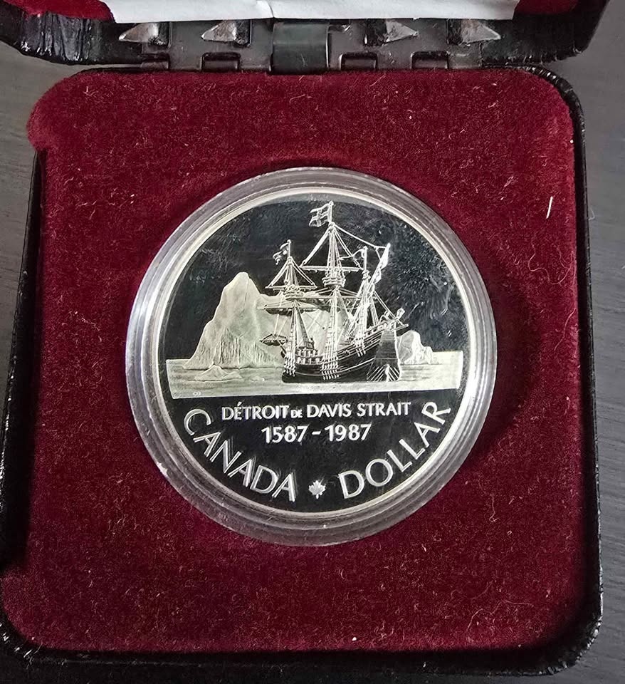 1986 and 1987 Canadian silver dollars.