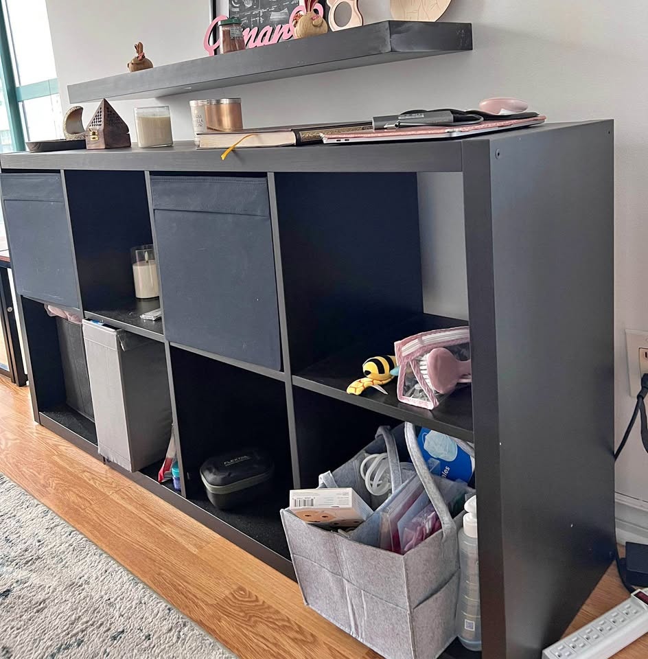 Black shelf unit ikea with storage boxes