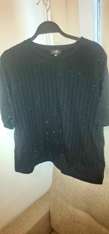 Women's black stud embellished top