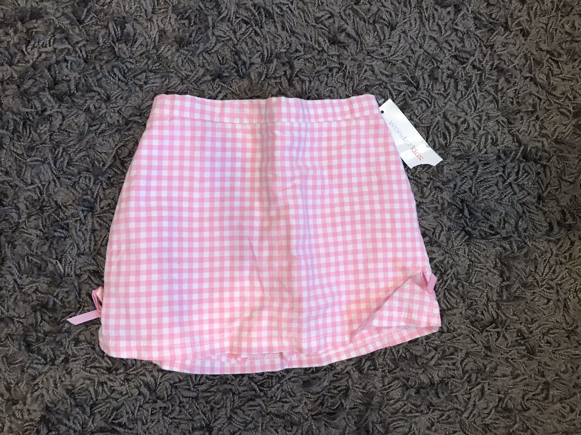 18 months brand new. Dress, coat, shorts, skirt, onesie. $5-7 ea