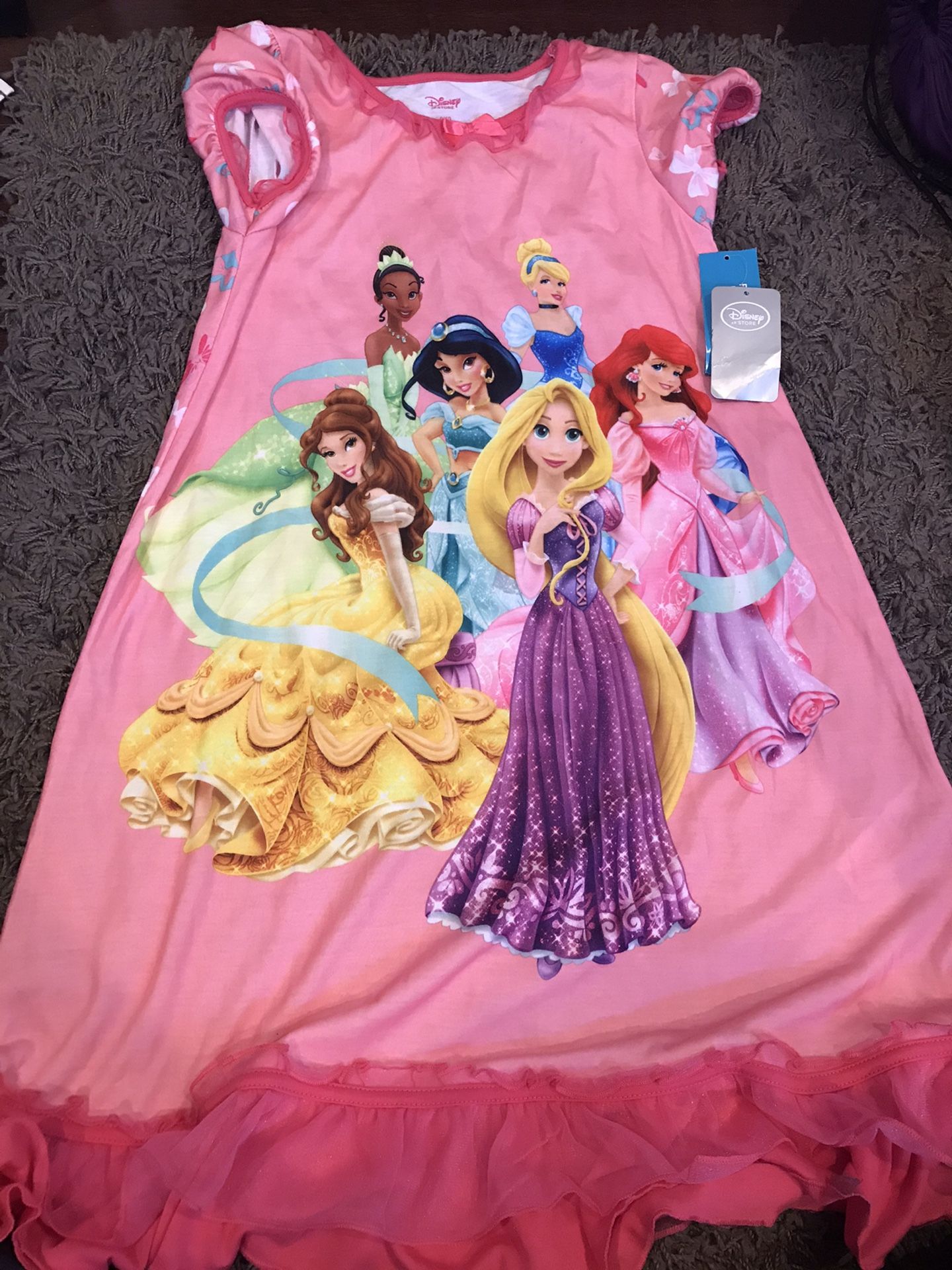 Size 7 Disney pajama and sweater, brand new. $10 each