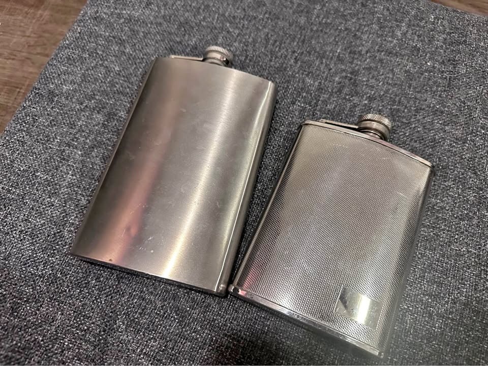 Two hip flasks