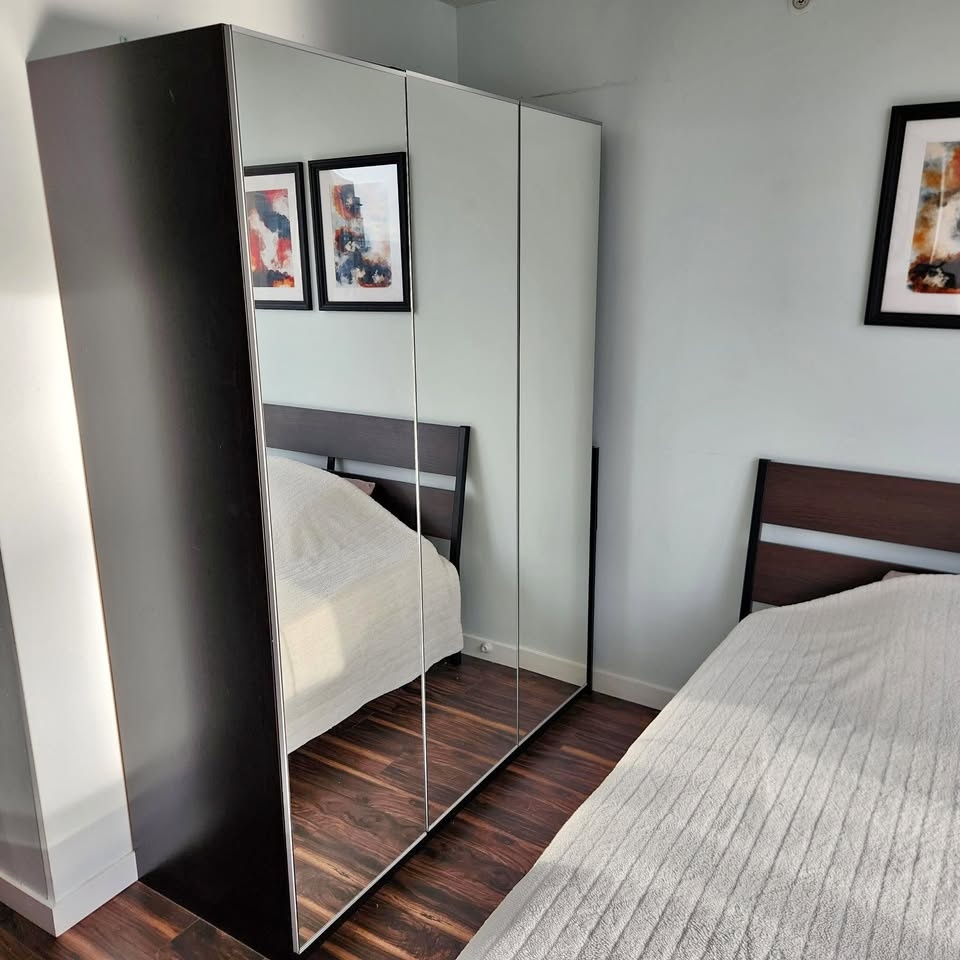 Full-sized Mirror Closet with lots of shelves