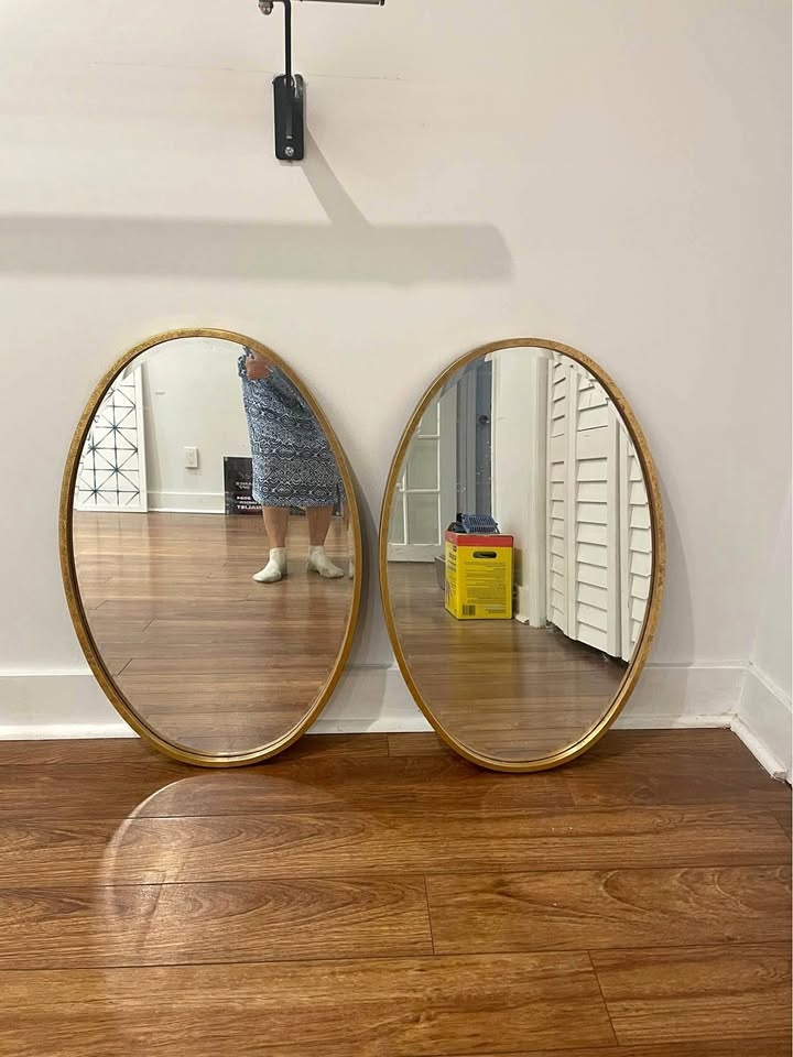 Two aged gold oval mirrors. Hoping to sell as a pair!