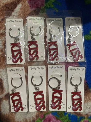 metal keychain and it says red kiss with a small pink kiss