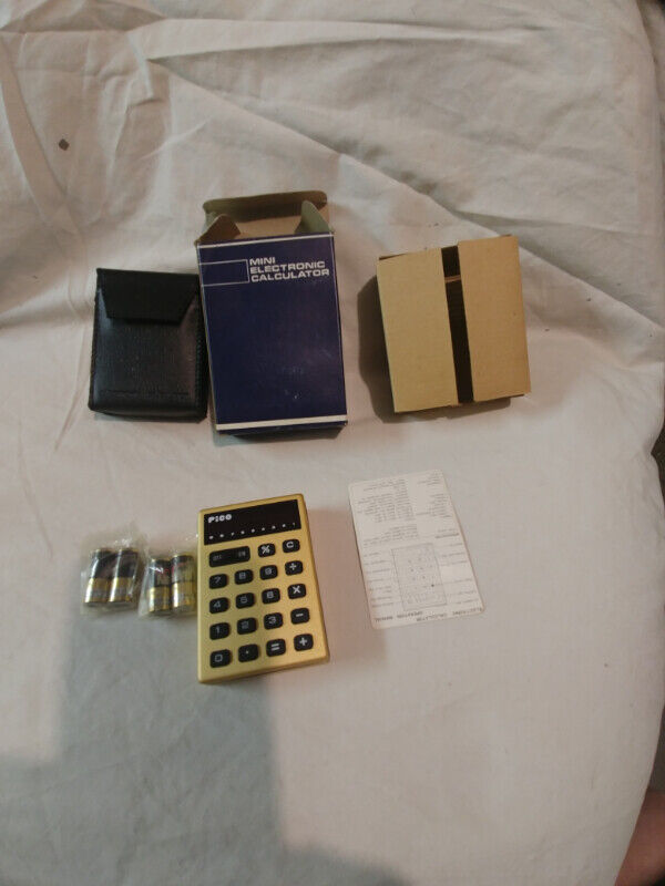 Vintage brand new gold color mini electronic calculator Japan