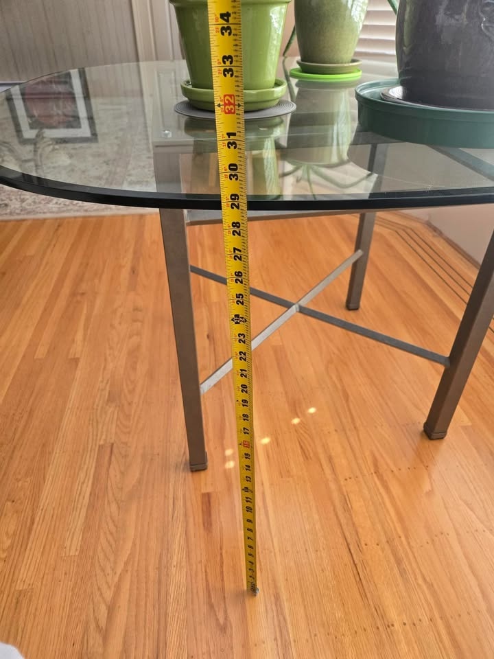 Glass rounded dining table with steel base - photo 4