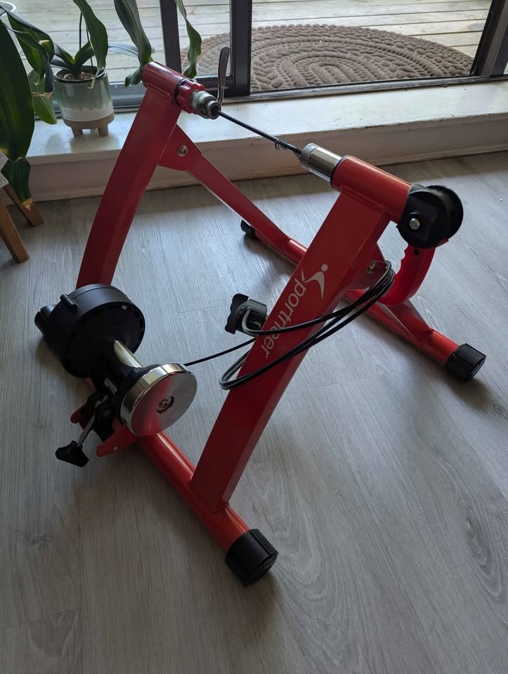Indoor bicycle trainer with adjustable resistance. - photo 2